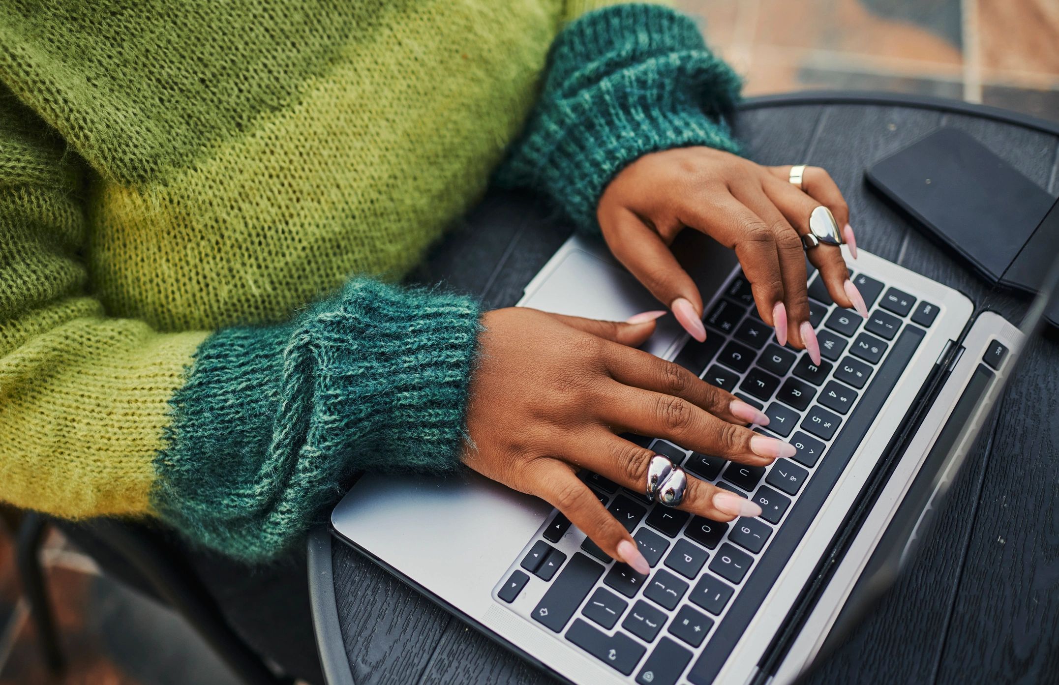 Person reading email updates on a laptop