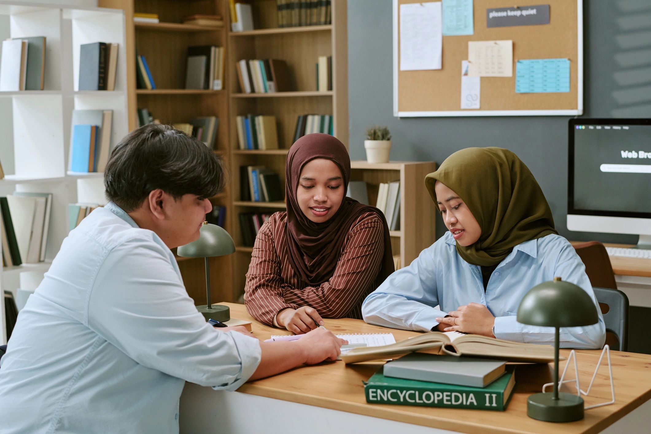 Students and tutor studying together